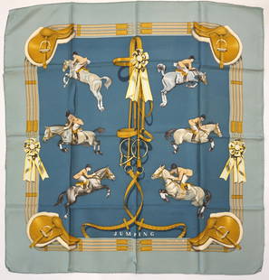 HERMES PARIS "JUMPING" SILK SCARF: HERMES PARIS silk &#8220;Jumping&#8221; scarf. The scarf features a symmetric display of multiple jumping horses in various moments of an equestrian tournament. The scarf is in muted tones of blue and