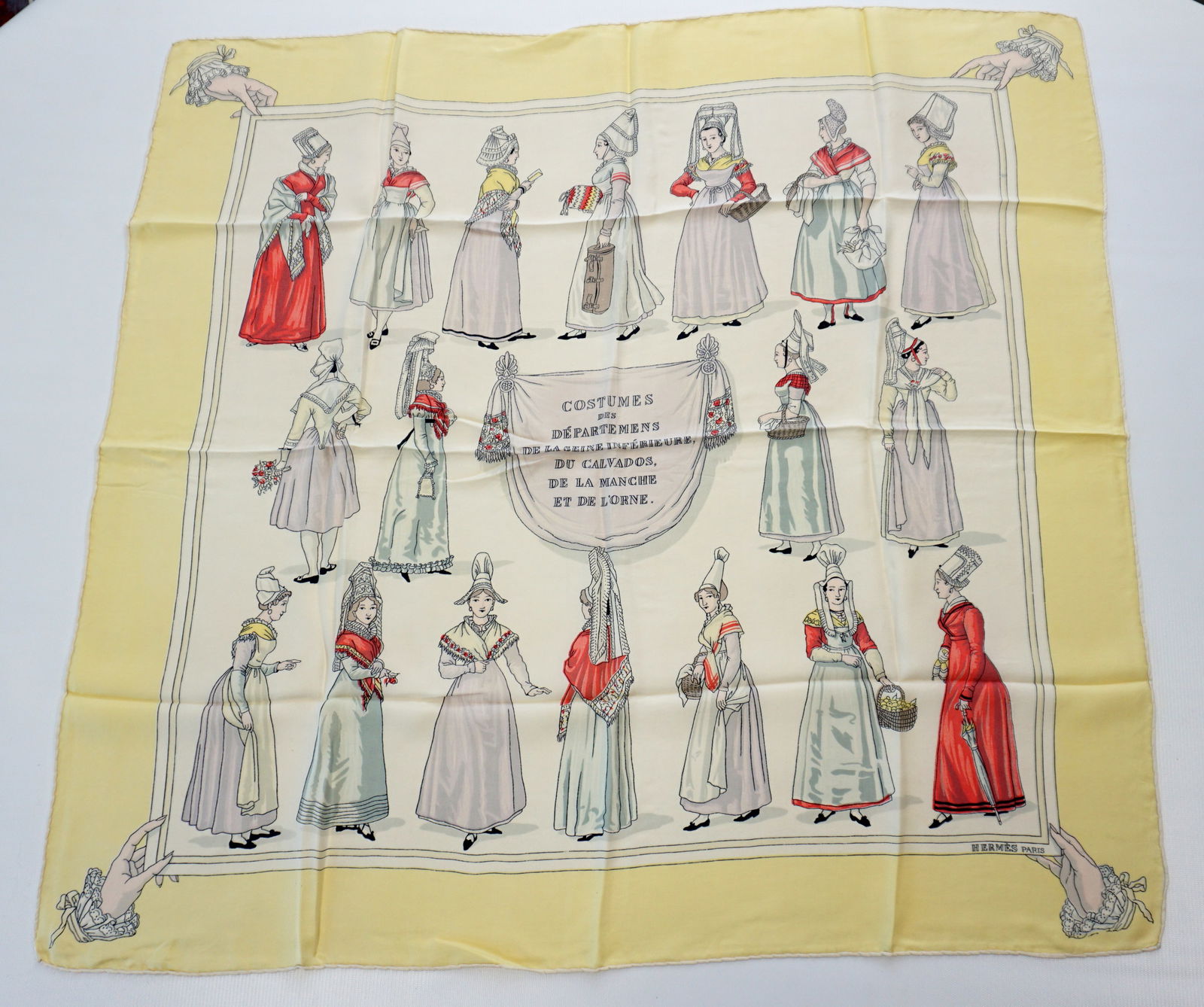 HERMES PARIS "COSTUMES NORMANDS" SILK SCARF: HERMES PARIS silk "Costumes normands" scarf. This scarf dates from 1950 therefore is especially rare and sought after. It displays the traditional feminine regional attires from various regions of Fra