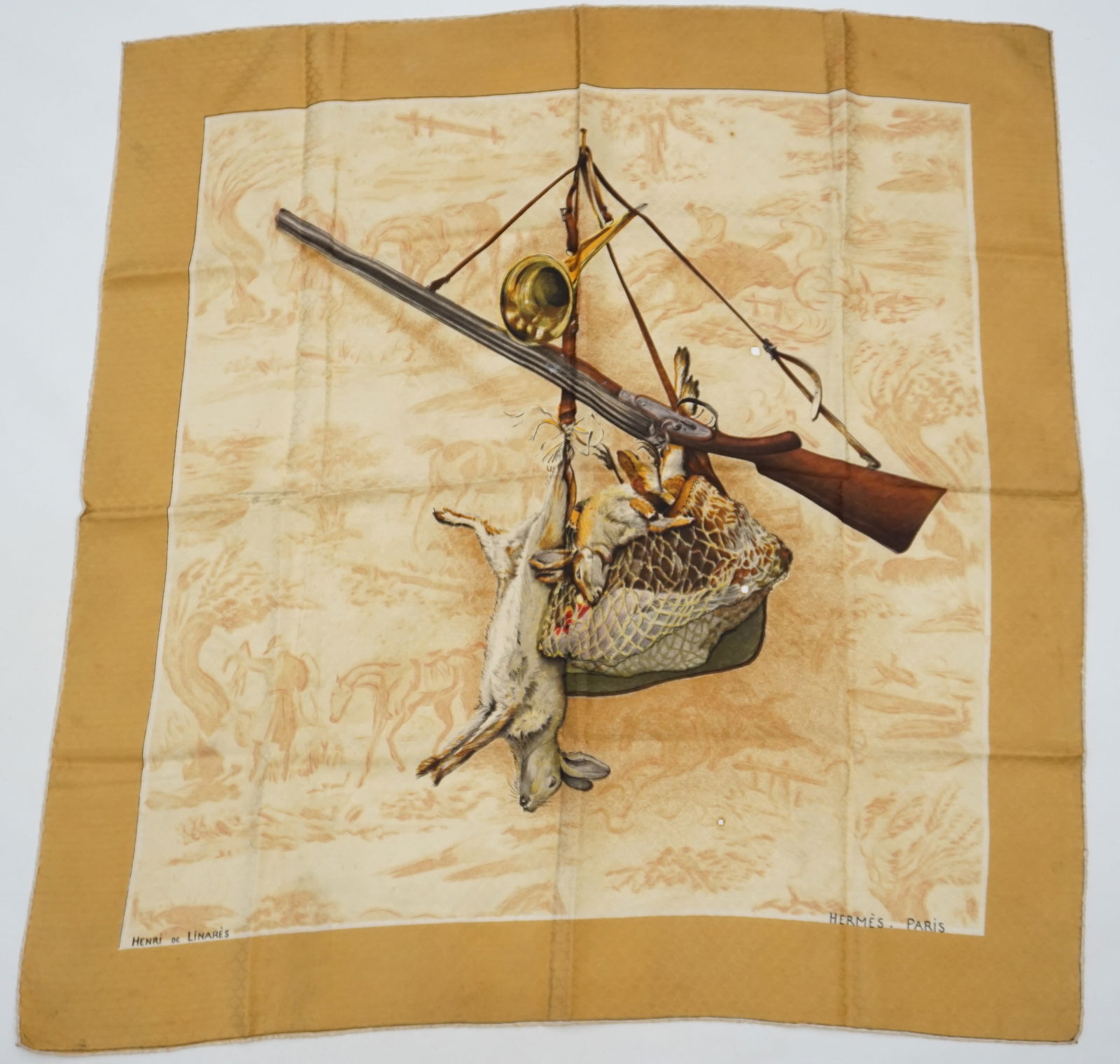 HERMES PARIS "LE RETOUR DU CHASSEUR" SILK SCARF: HERMES PARIS silk "le Retour du chasseur" scarf. This scarf is especially rare being a first and only edition from the 1950s. The scarf features a hunters bounty against an elegant backdrop of toile w