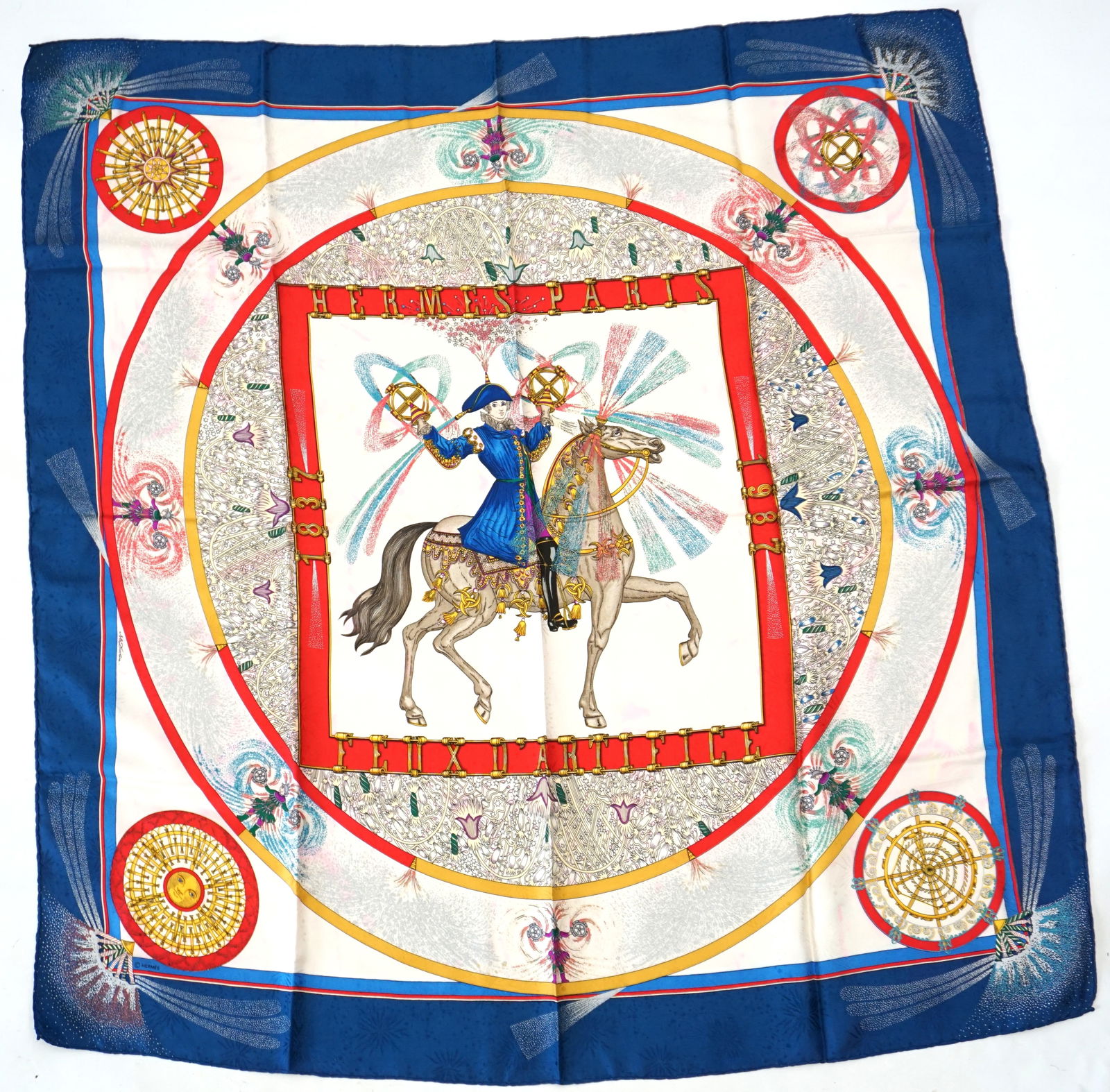 HERMES PARIS "FEUX D'ARTIFICE" SILK SCARF: HERMES PARIS silk "Feux d’artifice" scarf. This scarf is a special edition from 1987, for the 150th birthday of the Hermes house and the 50th birthday of the carre silk scarf. The scarf displays