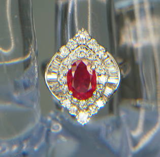 14KT WHITE GOLD 2.10CTS RUBY & DIAMOND RING: Gorgeous 14kt white gold Navette shape ruby & diamond cocktail ring. The ring features one (1), four prong set, 2.10ct oval faceted ruby set in the center of 1.06cts/tw of prong set round brilliant an