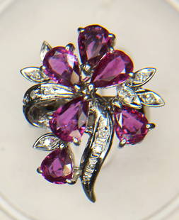 18KT WHITE GOLD PINK SAPPHIRE & DIAMOND RING: Fun spray open design 18kt white gold pink sapphire & diamond ring. The ring features six (6), prong set, pear faceted pink sapphires accented with fourteen (14), pave set, round single cut diamonds.