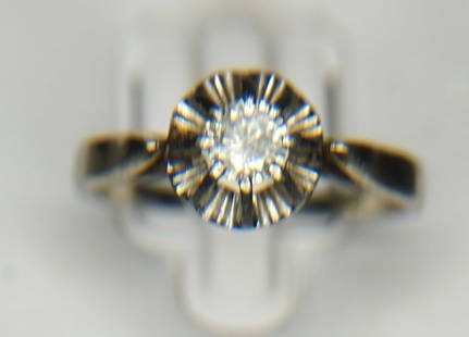 ANTIQUE DIAMOND SOLITAIRE RING: 18kt white gold diamond solitaire ring. The ring features one (1), six prong set, round brilliant cut diamond set in the center of a platinum illusion style fluted head set in a cathedral style shank.