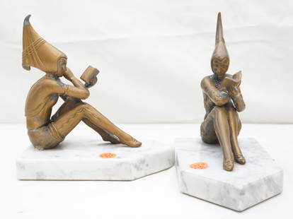 ART DECO STYLE FIGURAL PIXIES BOOKENDS: Pair of Art Deco style figural Pixie metal painted metal bookends. Each piece is set on a white marble base and measures approx. 7" long x 7.5" high with a total weight of 8.5 lbs. *One waist cracked