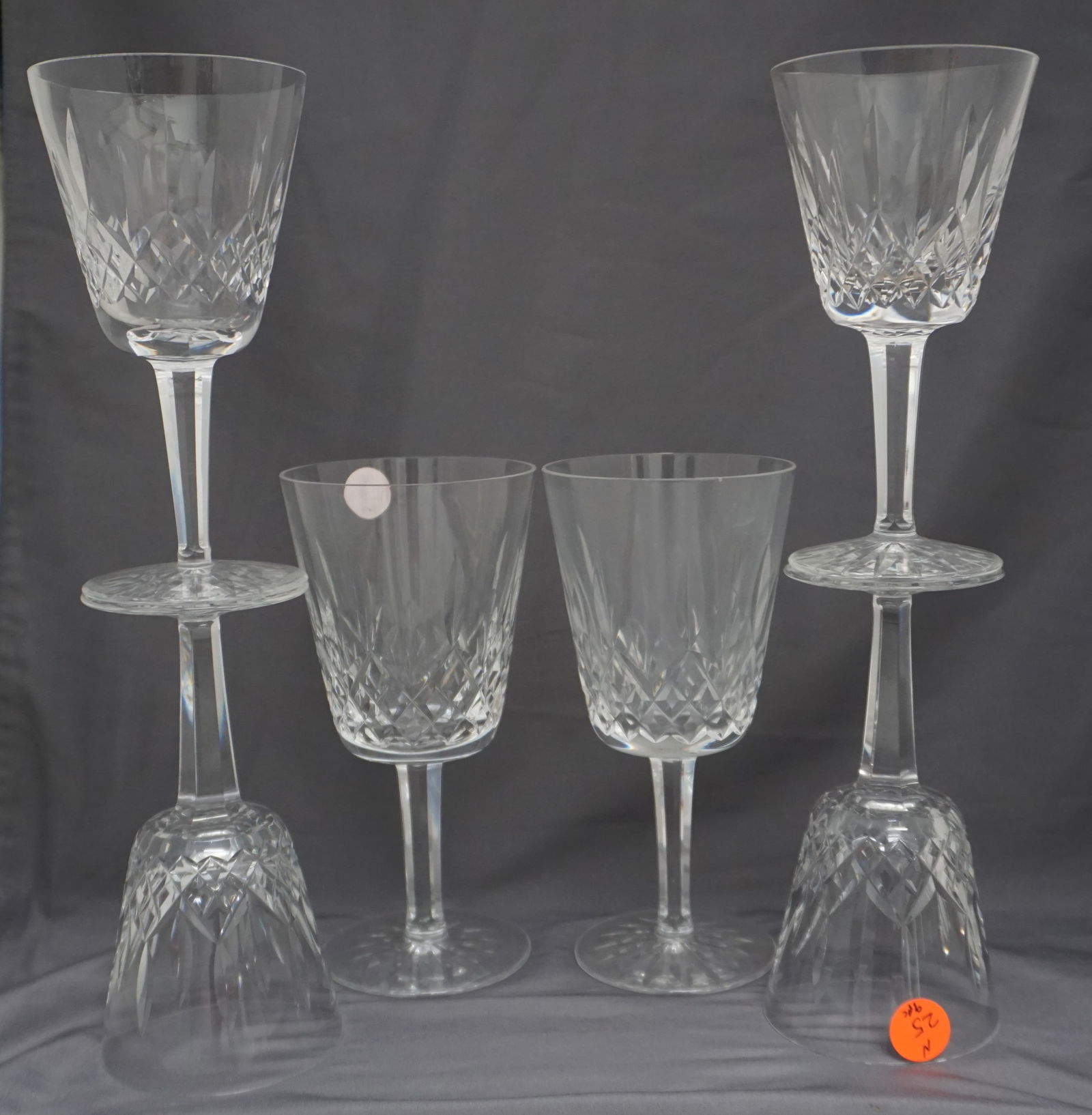 9PC WATERFORD CRYSTAL LISMORE GLASSES: Collection of 9 pieces of Waterford crystal glasses in the Lismore pattern. The pieces include: 3 sherry glasses, 2 goblets (tiny nick to one rim), 4 white wine glasses (nick to one rim). For over 60