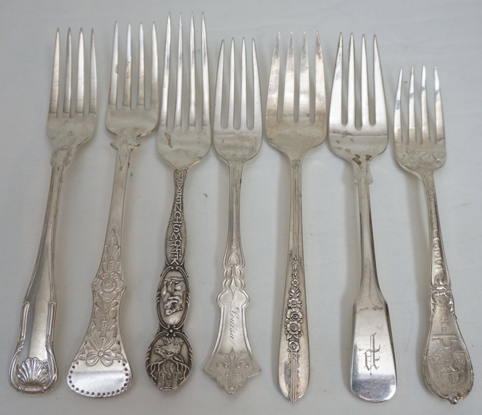 7 ANTIQUE SILVER FORKS: 5 Antique American Sterling Silver Forks, 1 830 Silver Fork and 1 Silver Plated Fork. Various makers 5 1/2" to 6 1/2". Weight sterling 135 grams. PROVENANCE: A Charleston SC Estate