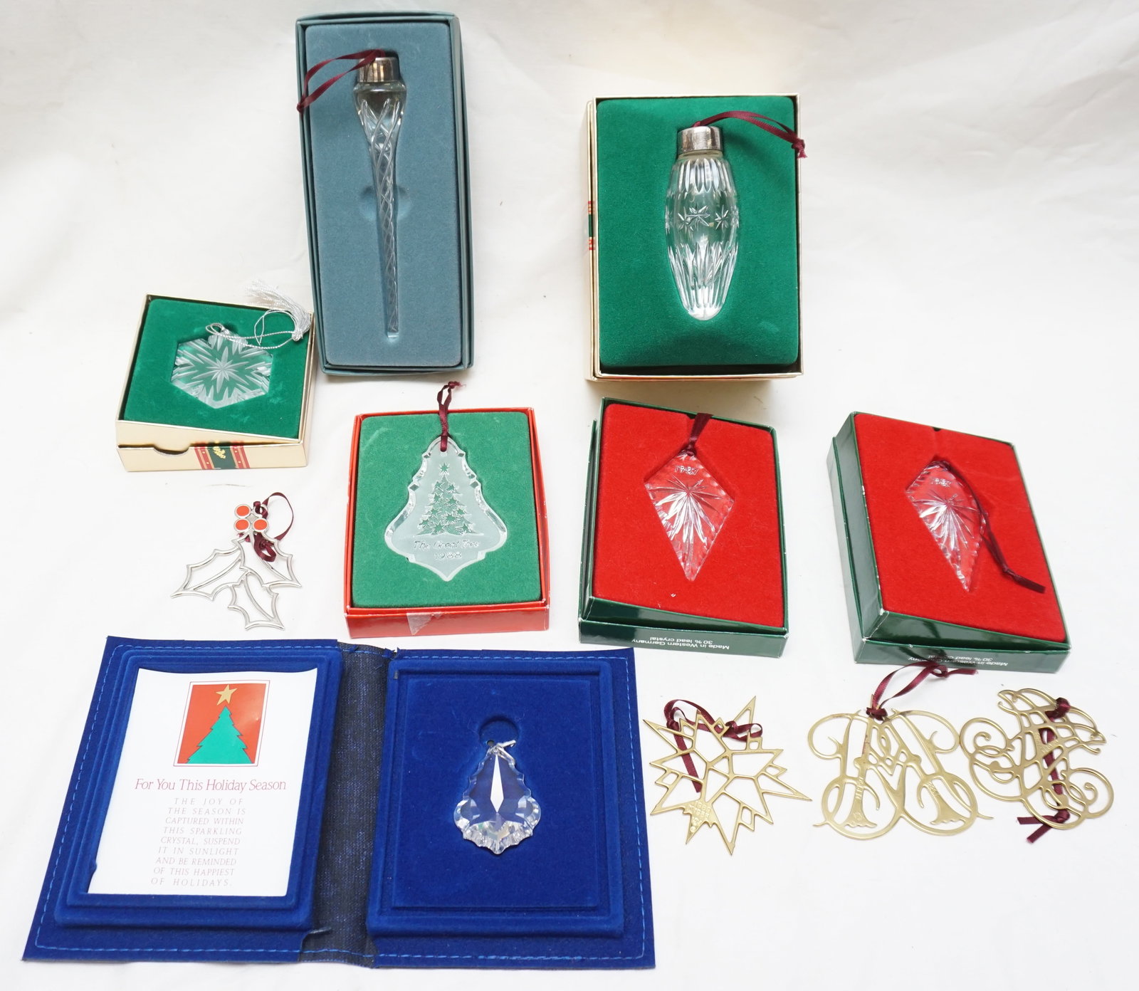 11 CHRISTMAS ORNAMENTS LENOX +: 3 Virginia Metal crafters, Gorham Silverplated Holly, Lenox Icicle, Lenox Bulb, Lenox Snowflake, 2 Ivey's Lead Crystal, Riches Tree 1988, Crystal Keepsakes. Weight on all 1 pd 12 oz. PROVENANCE: A Pri