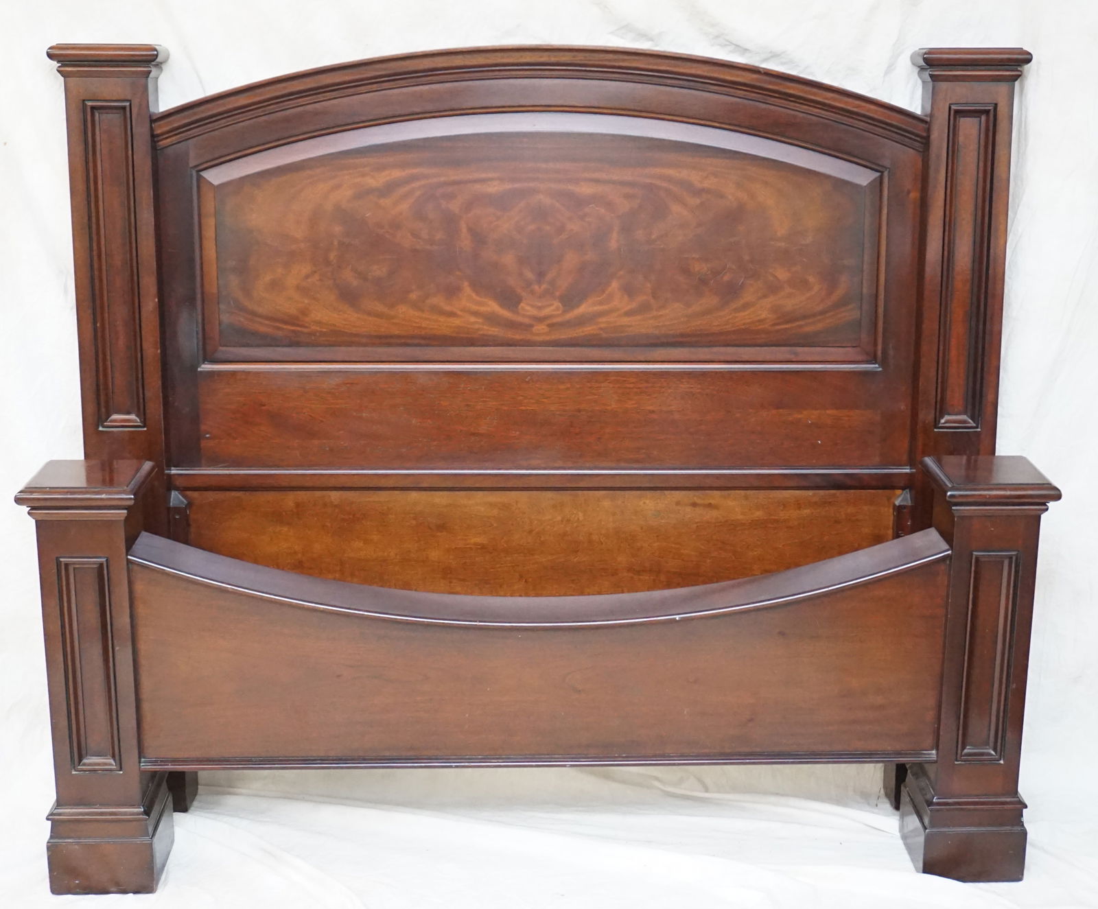 M CRAIG RAILROAD QUEEN BED: M. Craig and Company Mahogany QUEEN Bedstead: Experience the luxury of the 'Railroad Baron's Bed' crafted by M. Craig and Company. This masterpiece features an arched headboard with figured mahogany a