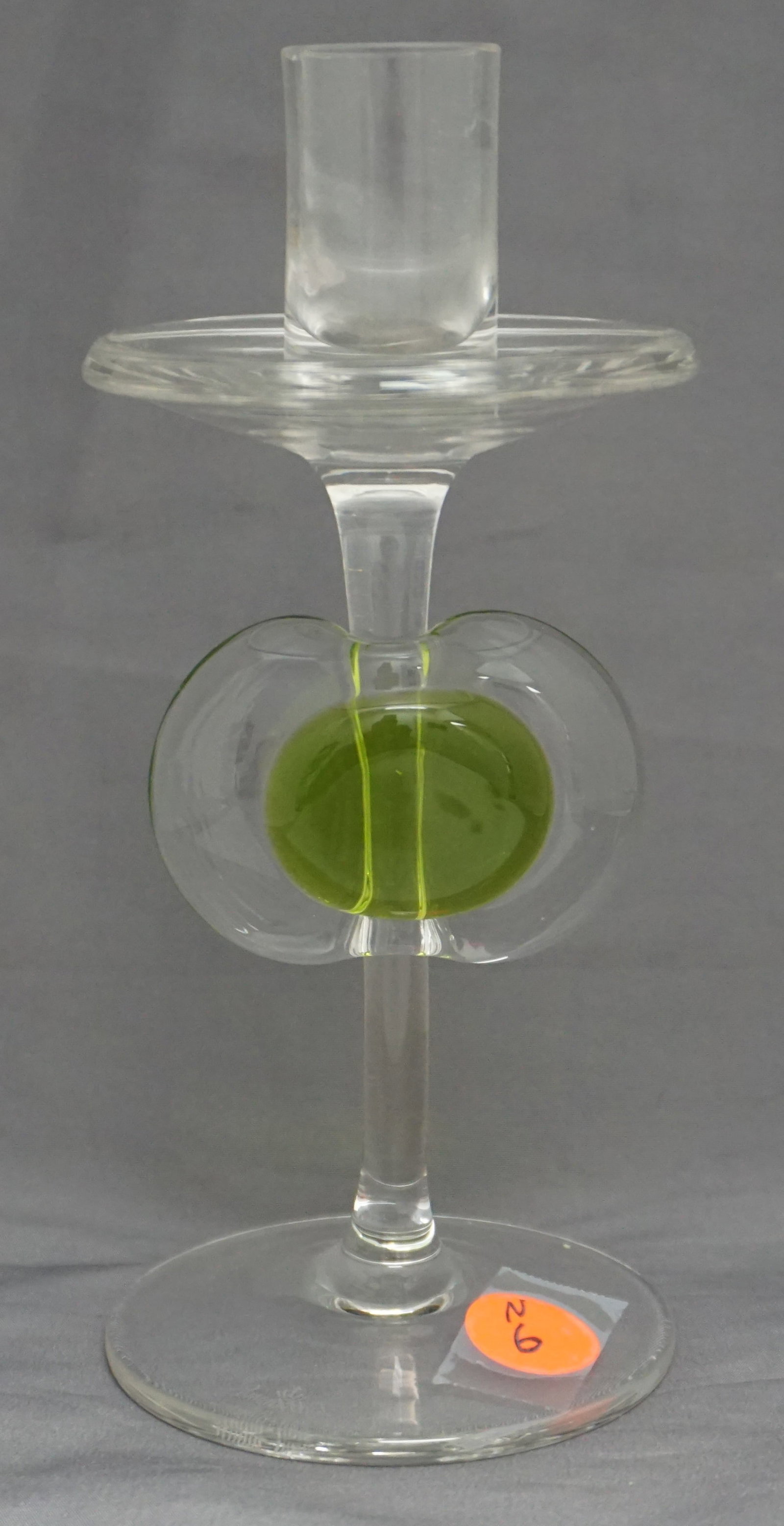 HAND BLOWN ROSENTHAL CANDLESTICK: Vintage hand blown Rosenthal candlestick. The piece is accented in the center of with a oval clear & lime green glass medallion. 7" high, 1lb.
