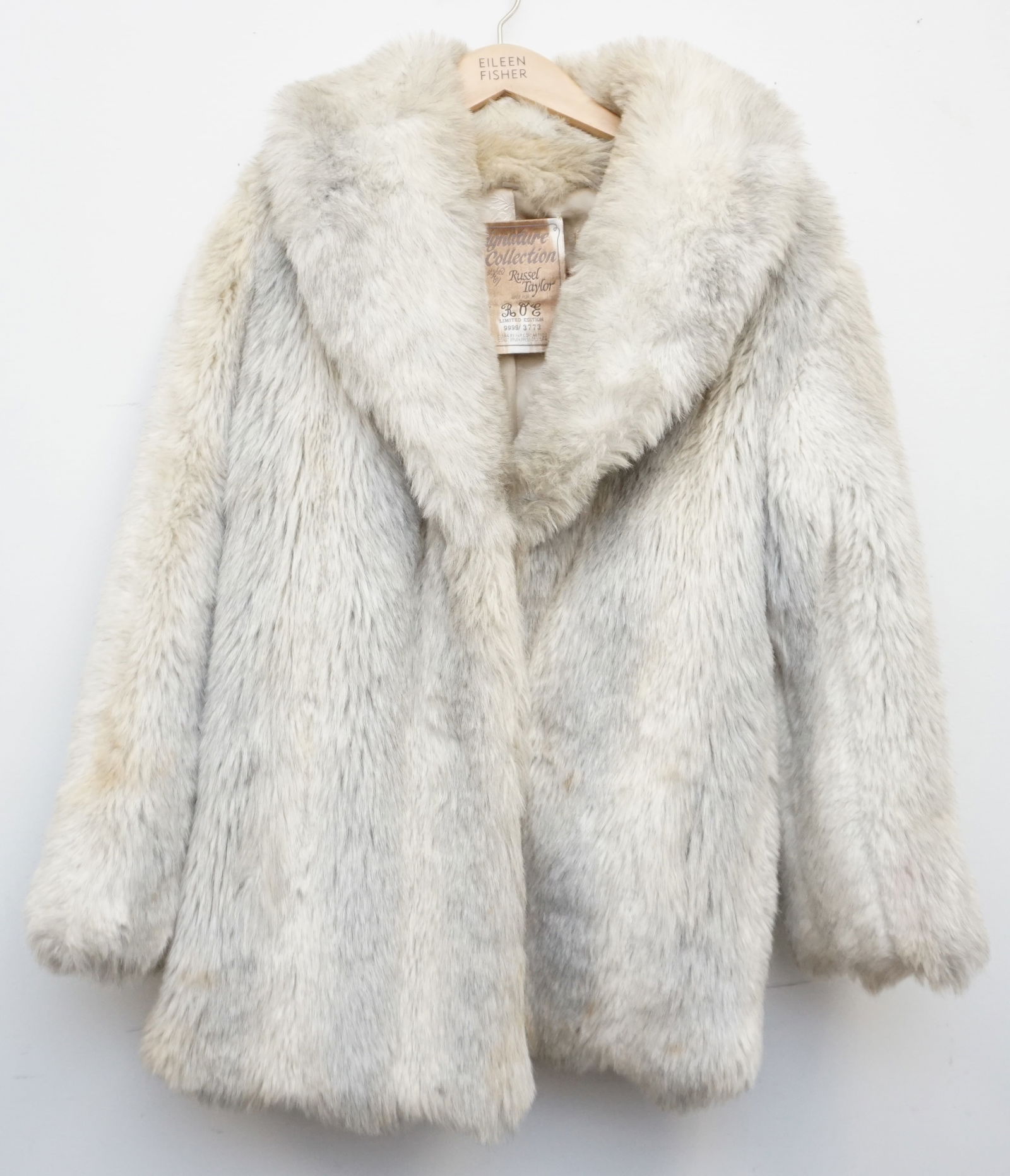 WHITE FAUX FUR COAT: Elevate your wardrobe with the vintage Russell Taylor Signature Collection white three-quarter-link faux fur coat, a limited edition treasure marked as 3337/9999. Crafted with the luxurious look and f