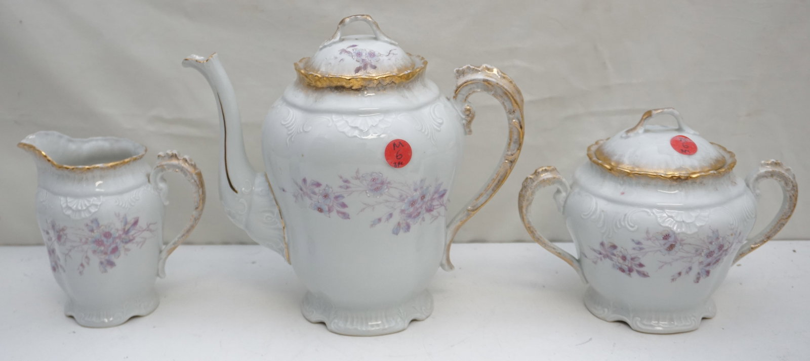AUSTRIAN COFFEE, SUGAR & CREAMER PORCELAIN: Experience classic Austrian elegance with this porcelain coffee, sugar, and creamer set. The coffee pot measures 9" tall and features delicate detailing, making it both functional and visually appeali