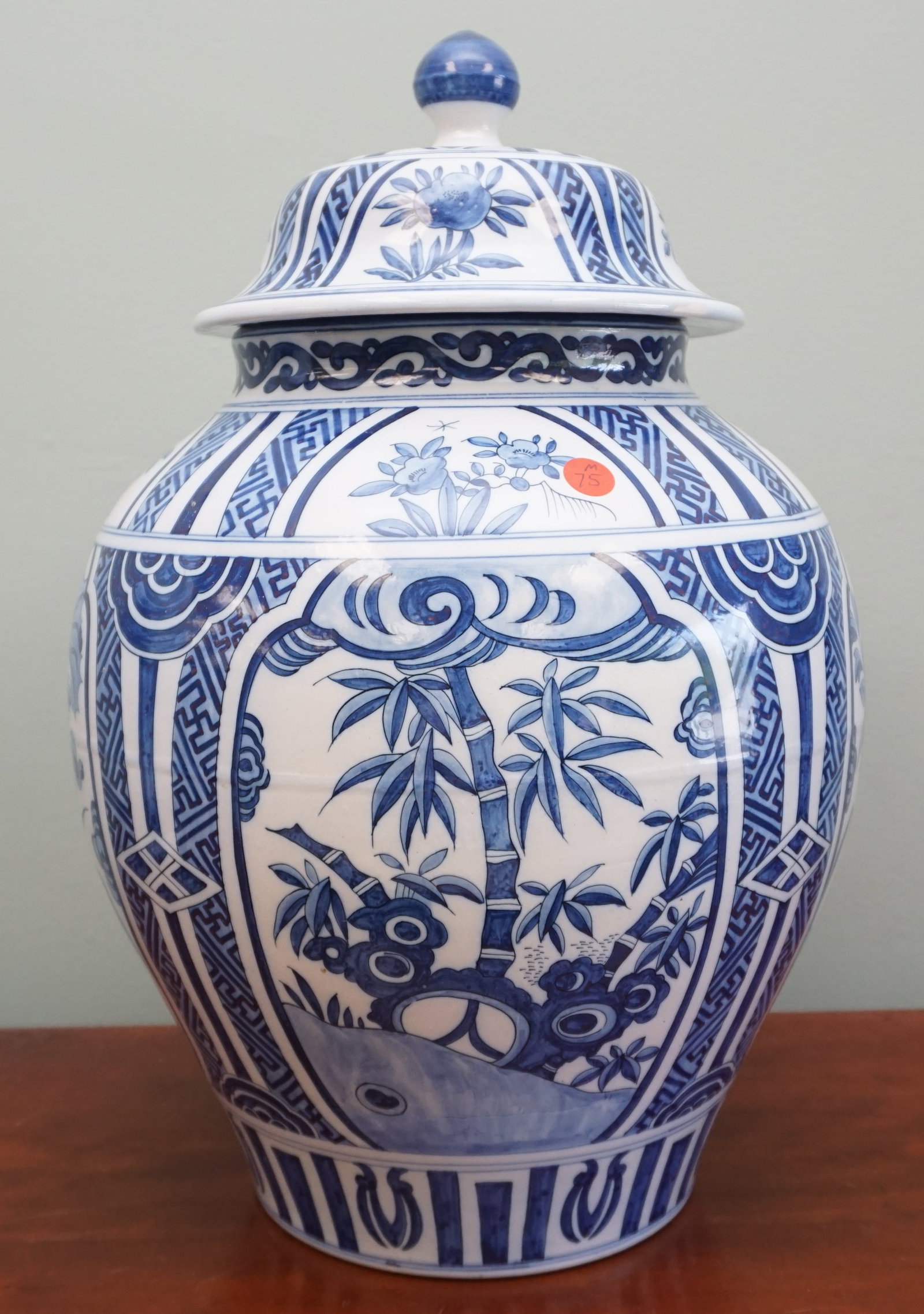 DUTCH BLUE & WHITE LIDDED VASE: Dutch Antique Blue and White Lidded Vase A splendid 20" tall Dutch antique vase with a secure lid, adorned in the classic Delft blue and white palette. The body is elegantly decorated with a serene la