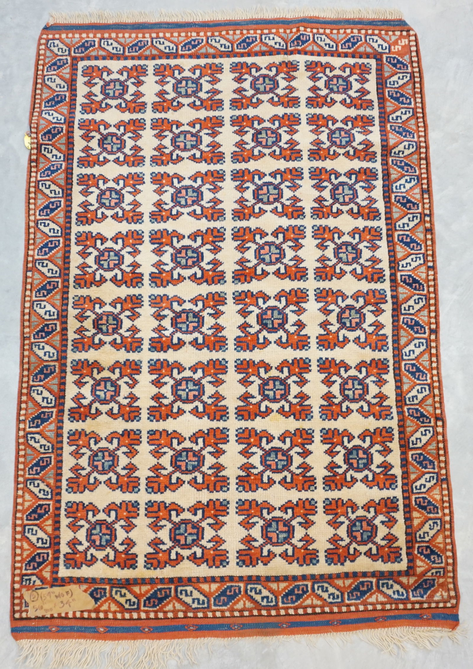 COMPACT & BOLDLY PATTERNED CREAM RUG WITH RED GEOMETRIC DESIGN (1 of 5)