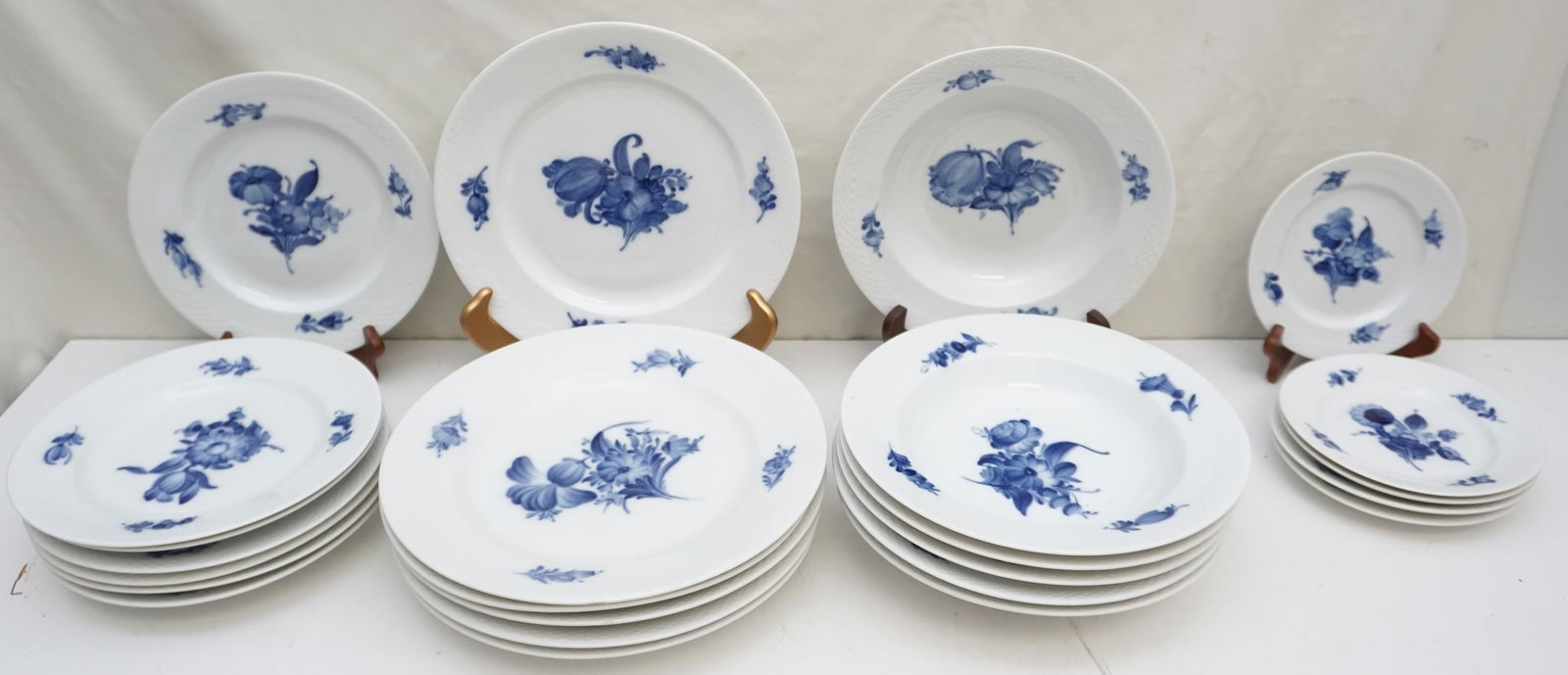 ROYAL COPENHAGEN BLUE FLOWER BRAIDED SERVICE FOR 6: This exquisite 24-piece Royal Copenhagen Blue Flower Braided service for six exudes timeless elegance. The set includes six of each: dinner plates measuring approximately 10.25" across, soup bowls mea