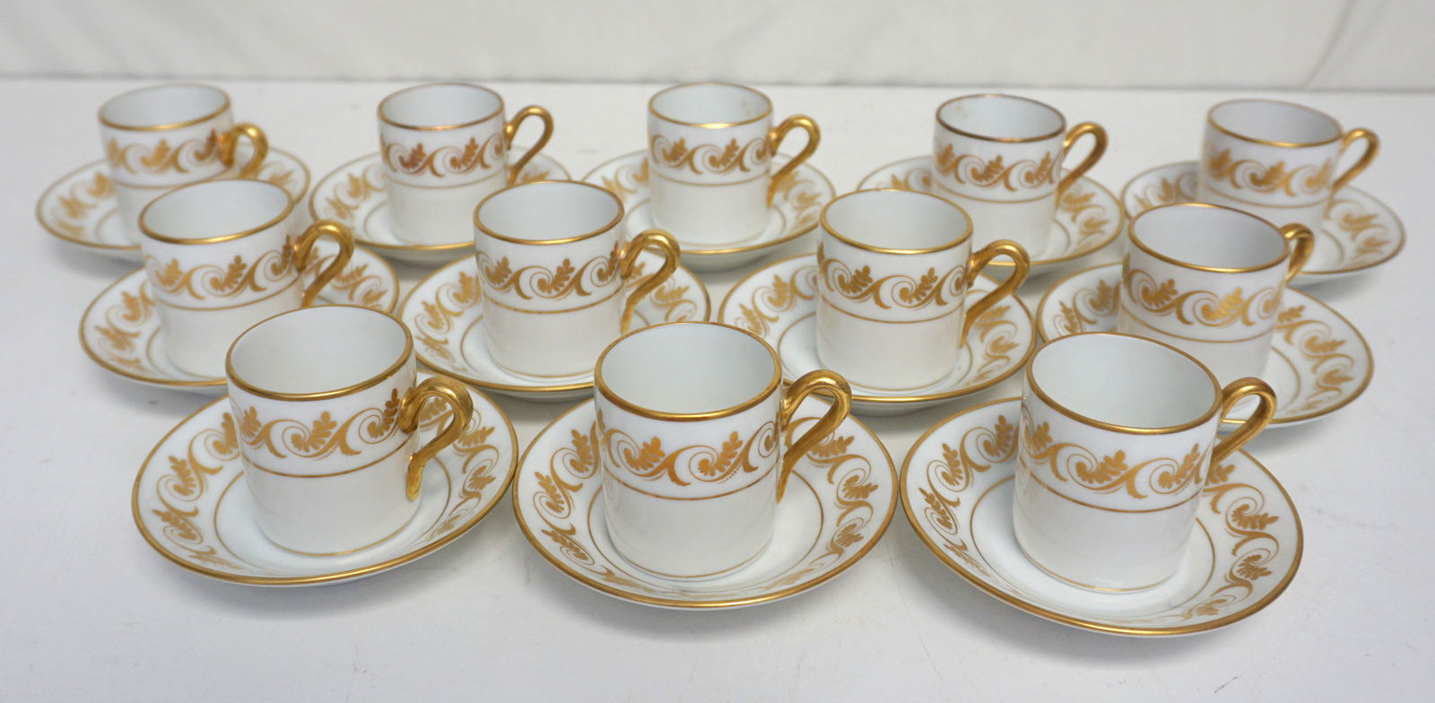 RICHARD GINORI CHINA: Richard Ginori White China with Gold Accents: Exquisite set featuring cups and saucers with intricate gold embellishments, epitomizing classic beauty. Perfect for high tea or special occasions, reflec
