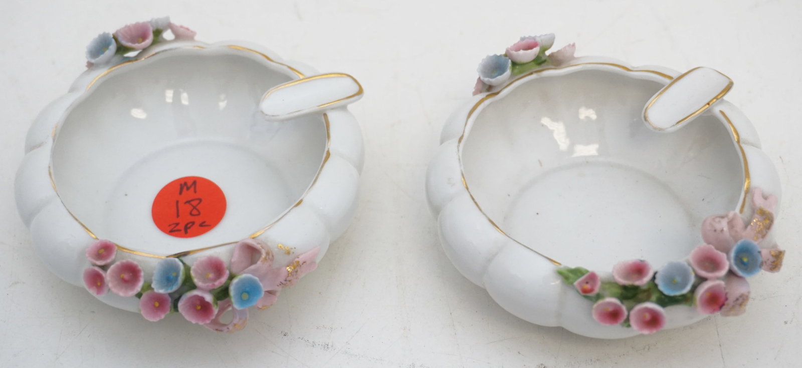 PAIR LEFTON HAND PAINTED ASH TYRAYS: This pair of Lefton ashtrays features delicate hand-painted details and measures 3.5" each. Signed "Lefton China Hand Painted", these pieces affirm their origin and craftsmanship.