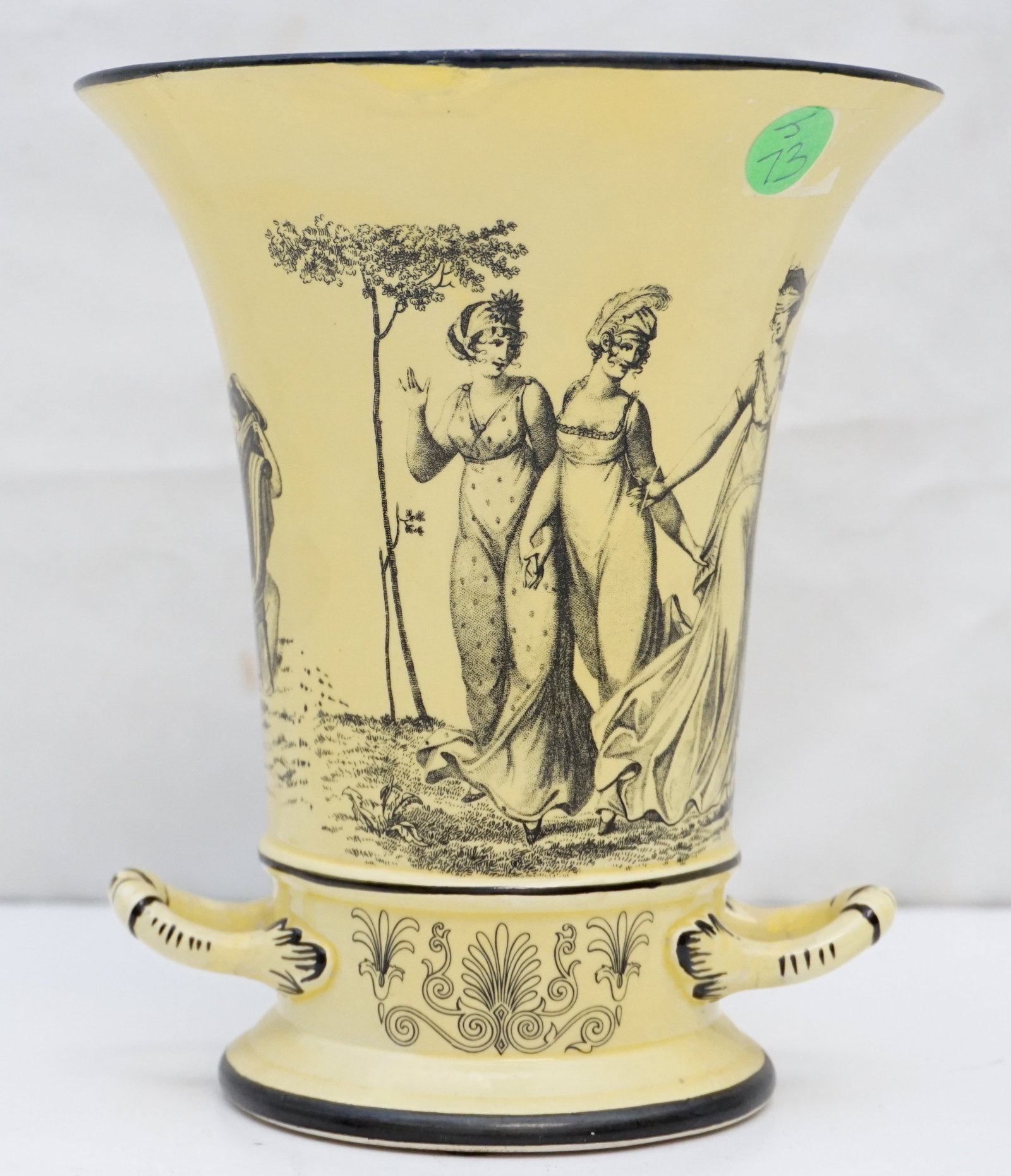 VINTAGE MOTTAHEDEH TOILE PLANTER: A vintage Mottahedeh toile handled vase, featuring a striking lemon yellow body contrasted with intricate black image accents. This finely crafted piece is signed on the bottom with "A Mottahedeh desi