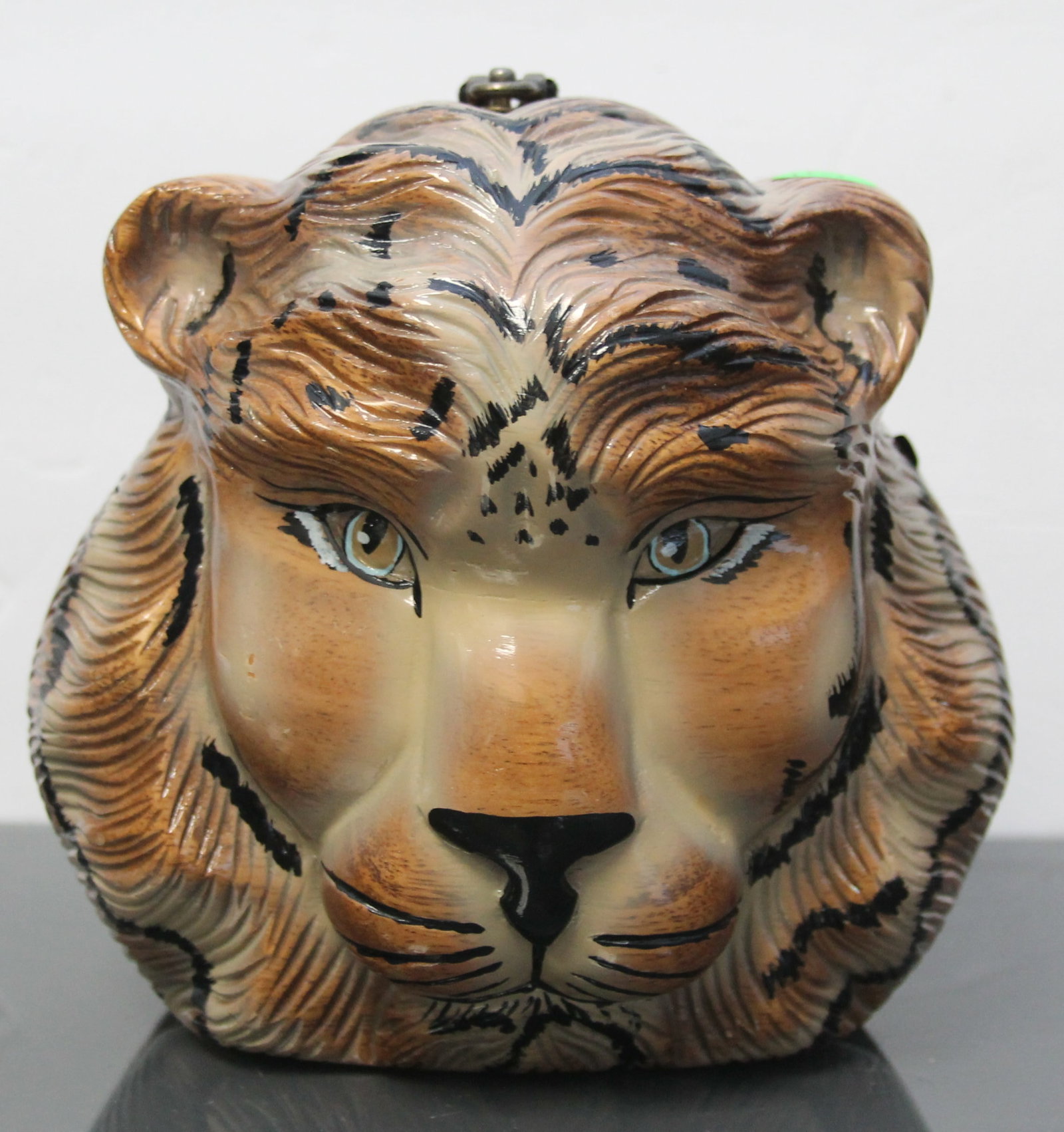TIMMY WOODS BEVERLY HILLS LION HANDBAG: Timmy Woods Lion handbag exquisitely crafted with a vibrant and detailed lion face design, capturing the majestic essence of the wild. This piece is signed on the bottom, ensuring authenticity and add