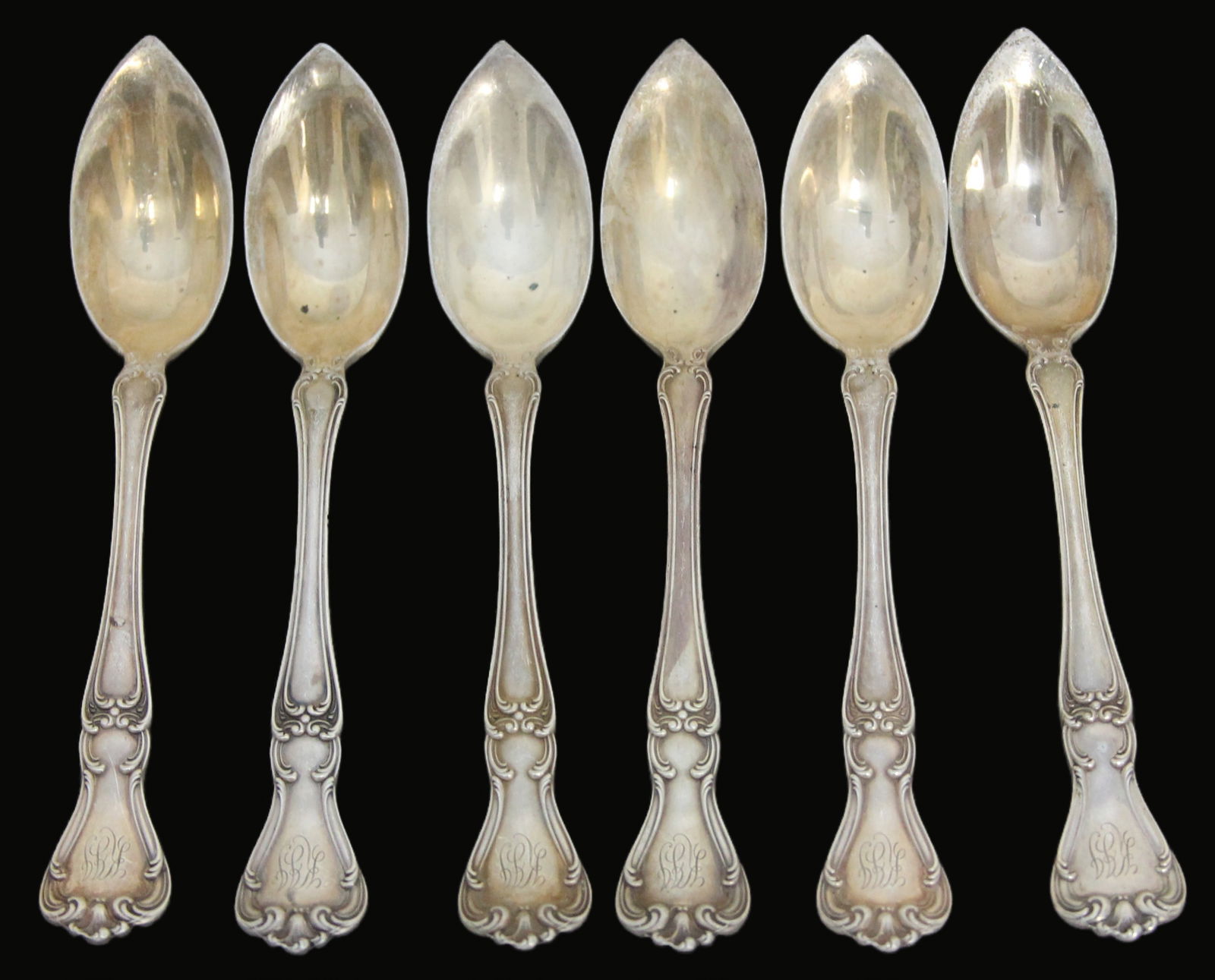 6PC CHANTILLY BY GORHAM - GRAPEFRUIT SPOONS: This 6-piece set of Chantilly by Gorham grapefruit spoons features monogrammed handles, each spoon measuring 5.75". The elegant Chantilly pattern adds a touch of sophistication to these practical uten