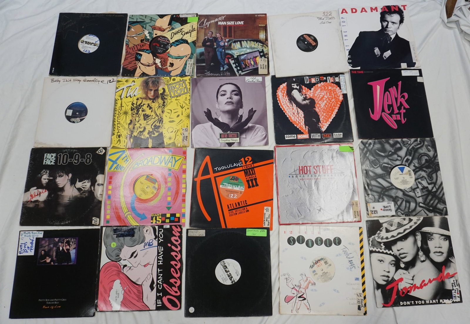Classic and Modern Vinyl Records: Showcases a mix of classic and contemporary sounds with records like "You Can't Have Your Cake and Eat It Too" by B.T. Express and "Music for the Masses" by Depeche Mode, reflecting the evolution of d