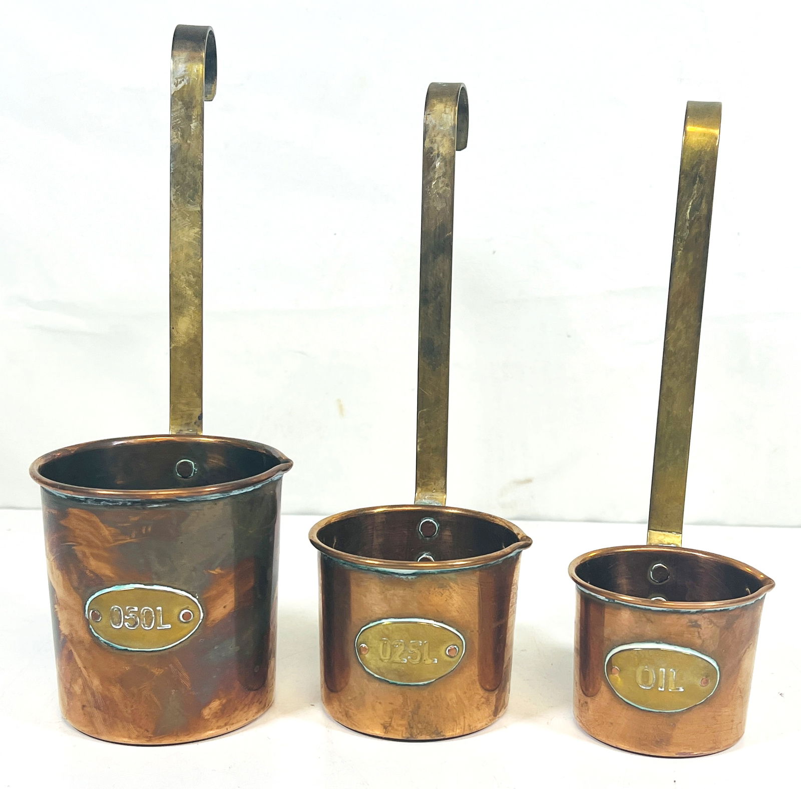 THREE PIECE COPPER MEASURING CUPS (1 of 5)