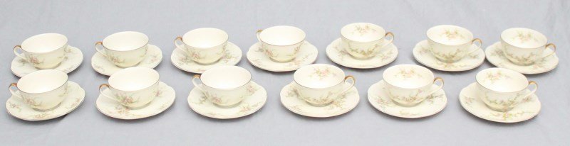 13 SETS HAVILAND ROSALINDE TEACUPS AND SAUCERS: Lot of 13 Theodore Haviland Rosalinde Pattern Flat Cup and Saucer Sets c. 1940s. All are in like new condition and appear to of never been used. Delicate pink and purple flowers with cream rim and gol