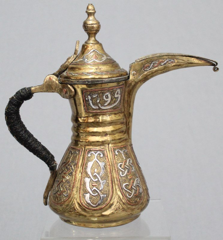 EXCEPTIONAL ARABIC ISLAMIC DALLAH BRASS SILVER COPPER: Exceptional antique ornate Arabic Dallah. Solid brass heavily inlaid with silver and copper. The neck features a cartouche with Islamic calligraphy on either side. The spout cover has a rolled "hooked