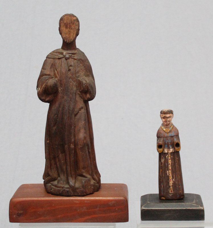TWO ANTIQUE WOOD CARVED SPANISH SANTOS WITH STANDS: Lot of 2 Antique Wood Carved Spanish Santos. The smaller 6" is polychromed missing hands and with paint loss. The larger 11" missing face and hands with the Santero initials ALE on the bottom. Both ca