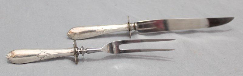 VINTAGE STERLING SILVER CARVING SET: Vintage Sterling Silver Handled Carving Set. Fork prongs and knife blade are stainless steel. Ornate script monogram, elegant petal pattern to handles. Marked sterling. Knife measures 10". An elegant 