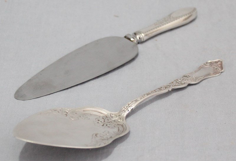 LOT OF 2 VICTORIAN SILVER PASTRY / PIE SERVERS: Group of 2 Antique Victorian Silver Pastry and Pie Servers. The ornate pastry server is a Rogers Alhambra Pattern with the older anchor mark and is silverplate. The pie server is sterling handled.