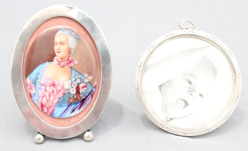 TWO (2) STERLING SILVER PICTURE FRAMES: Two Vintage Sterling Silver Picture Frames. One oval frame by Watson Company, Sterling 2908 measuring 5"x3.75" with a porcelain portrait medallion. The other is round by Lullaby Sterling 1909, measuri
