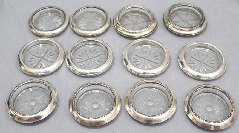LOT OF 12 STERLING RIMMED COASTERS - WHITING - ROGERS: Group of 12 Sterling Silver Rimmed Glass Coasters. 4 by Frank M. Whiting, 4 by F.B. Rogers, 2 by Wallace and 2 unknown. Provenance : Charleston SC Estate
