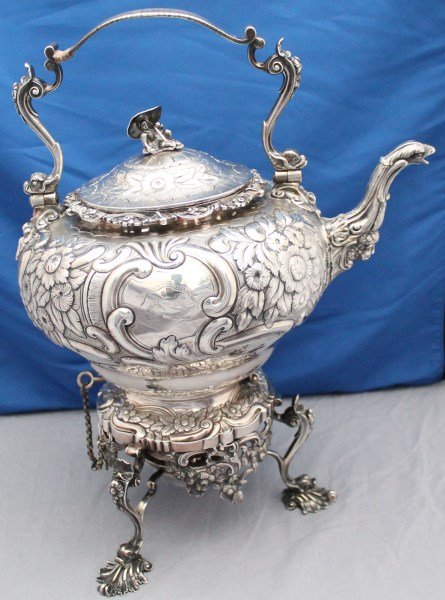 GEORGIAN STERLING 1817 MONUMENTAL ORNATE KETTLE W STAND: Superb Antique Monumental Georgian Solid Silver Hot Water Tea Kettle on a three dolphin foot spirit burner stand, also in sterling. Of inverted pear shape, extensively chased with flowers and foliage,