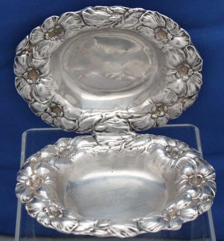 2 STERLING SILVER POPPY REPOUSSE MINT / NUT BOWLS: Lot of 2 matching Antique Sterling Silver Mint / Nut Bowls. Both are a repousse poppy pattern and were made by Watson Sterling. Each numbered 1093 1/2. They measure approx 4 x3.25x1 and weight total i
