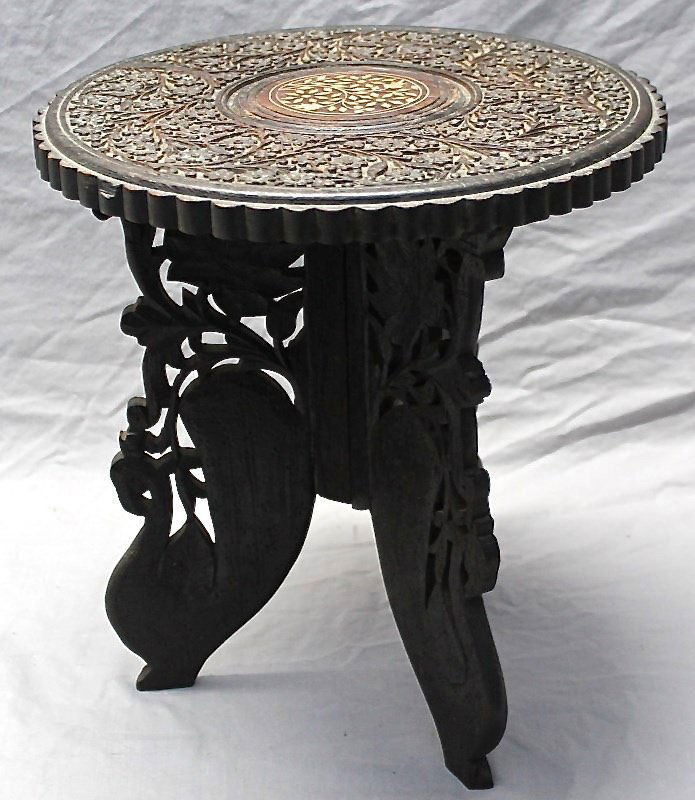 ANTIQUE ANGLO INDIAN MUGHAL TEA TABLE INLAID: Older carved hardwood and inlaid Anglo Indian Mughal Tea Stand / Lamp Table. Collapsible stand, deeply carved ornate floral round top with with inlaid bone floral accents. Used on table tops it can al