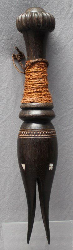 FIJI CANNIBAL FORK - CULA NI BOKOLA: This very fine Fijian ceremonial fork (cula ni bokola) is in good condition and has a superb, deep patina, early 20th c.. It has four tines, and a baluster form handle which finishes with a button-sha