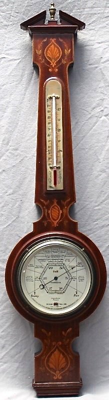 1927 ENGLISH ANEROID BAROMETER INLAID FRUITWOOD CASE: English aneroid barometer Stormoguide by Short & Mason, London copyright 1927. Set into inlaid fruitwood Sheraton style case. Altitude adjustment wheel on back. Bottom reads International United State