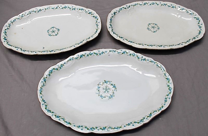 3 PC L. STRAUS CORNFLOWER SERVING PLATTERS AUSTRIA: Antique L. Straus & Son Austria 3 Oval Serving Platters. Two matching measure 12x7 1/2 wide and the large one measures 13 1/2x9. Delicate blue cornflowers on all, elegant table settings. Provenance: A