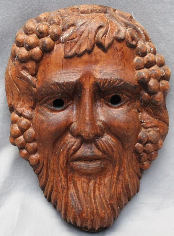 ITALIAN CARVED BACCHUS GOD OF WINE PLAQUE: Bacchus God of Wine Solid Wood Carved Wall Plaque, 10". Purchased in a antique shop in Rome. Skillfully carved and with great patina. Provenance: Hilton Head South Carolina Private Estate.. Measures 1