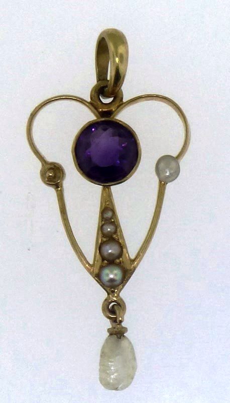 14k EDWARDIAN AMETHYST LAVALIERE PENDANT: A delicate Edwardian 14kt yellow gold antique amethyst & seed pearl lavaliere pendant. The lavaliere is approx. 1.25 x 0.50, and has an open design. The piece features one (1), bezel set amethyst set 