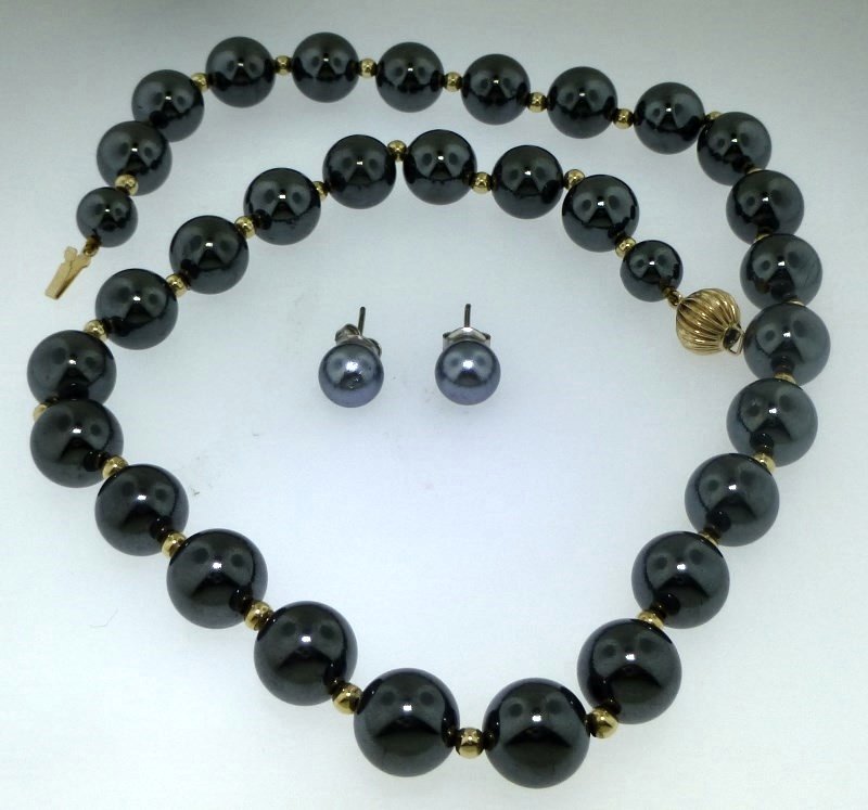 2pc ESTATE 14K GOLD BEAD HEMATITE NECKLACE + EARRINGS: This lot is a set of two pieces, including a hematite and 14kt gold bead necklace and a pair of synthetic black pearl earrings. The hematite necklace is approx. 16.75 in length and alternates between