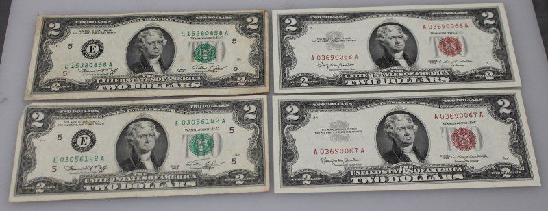 LOT OF 4 $2 BILLS- RED & GREEN SEALS: Lot of four two dollar bills. Two of the bills a are 1963 red seal bills with the numbers A03690067A and A03690068A, both bills are in excellent condition. The green seal bills are not in order and ar