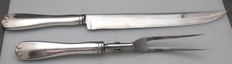 TIFFANY STERLING LARGE CARVING SET - FLEMISH 1911: Tiffany Sterling Silver Large 2 Piece Roast Carving Set the 1911 Flemish Pattern. Carving Knife measuring 14" and Fork 11". Both with Stainless Blade and Tines. PROVENANCE: The Estate of noted NYC att