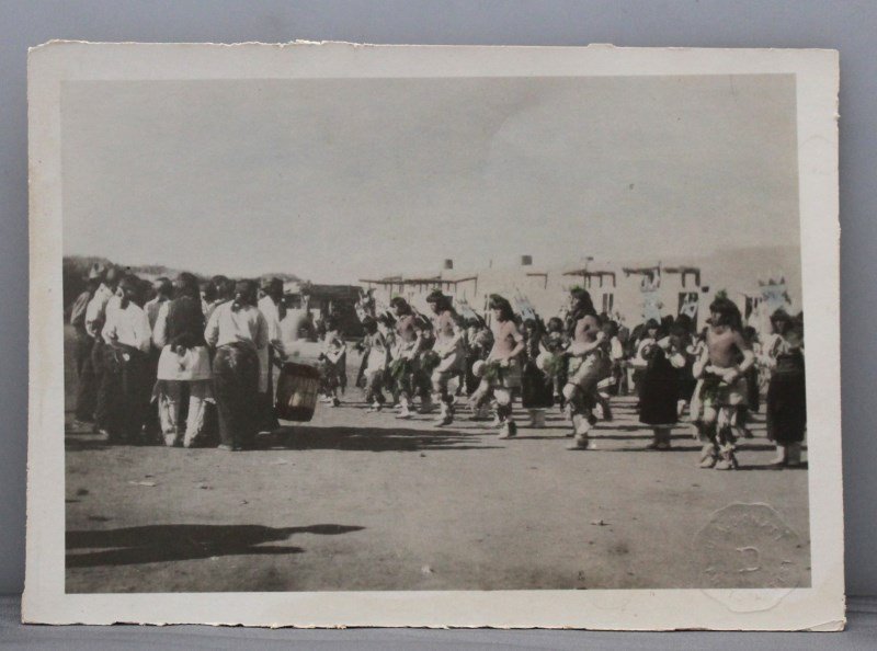 SANTA DOMINGO PUEBLO DANCERS H/C PHOTOGRAPH - DONATI: A Hand Tinted Photograph of a group of Santa Domingo Pueblo Dancers 1915 -1920 by U. Agostino Donati, with studio blind stamp. Very lightly tinted. Measures 5 x7. PROVENANCE: The Estate of the Donati
