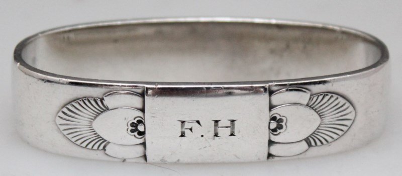 GEORG JENSEN STERLING CACTUS NAPKIN RING: Vintage Georg Jensen Sterling Napkin Ring #81 in the much loved Cactus Pattern c. 1930. Desined by Gundolph Albertus and having his initials inside. Measures 2 1/2 wide and weighs a hefty 54 grams. PR