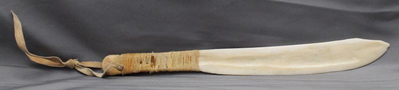 NATIVE AMERICAN BONE HIDE SCRAPER W SINEW HANDLE: Old American Indian Bone Hide Scaper Knife. With a sinew wrapped handle and a hide strap. A very useful implement for scraping and cleaning animal hides. Very good speciman. Measure 9 1/2 long. PROVEN