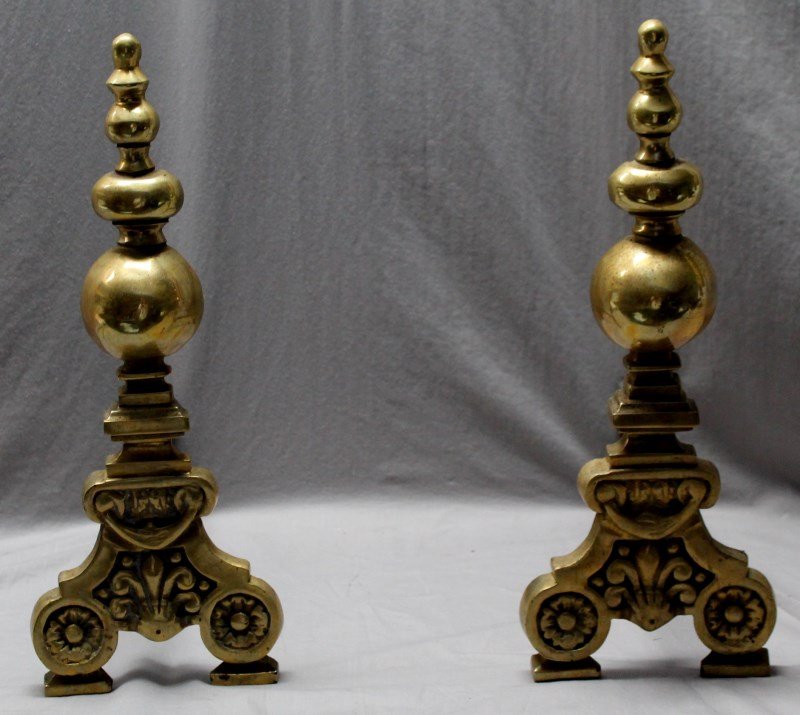 ANTIQUE CONTINENTAL BRASS ANDIRONS: Antique 19th c. Continental Brass Andirons. Floral scroll feet, fleur de lis and bulbous finials. PROVENANCE: A Charleston South Carolina Private Estate. Each 18" tall, 7" wide, 15" deep, weighs 17lbs