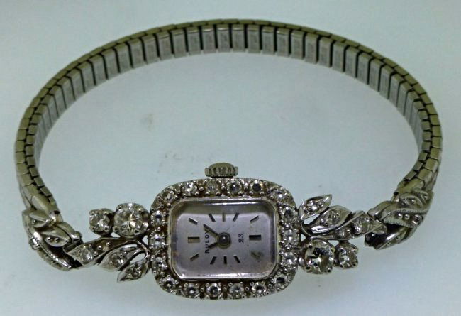 DIAMOND 14K GOLD LADIES WATCH: What a great watch!! This lady’s 14kt white gold & diamond Bulova wrist watch is a statement piece in any jewelry collection. The case of the watch is 14kt white gold and measures approx. 39.50mm (1