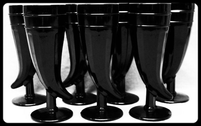 7 pc TIARA BLACK AMETHYST PILSNER GLASSES: Lot of 7 Vintage Tiara Large Black Glass Powder Horn Pilsner Glasses. Tiara glass was manufactured by a number of companies, including Indiana Glass Company, Fenton Art Glass, L.E. Smith and Duncan & 