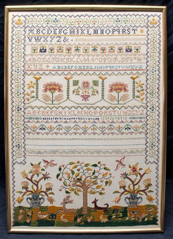 AMERICAN SCHOOLGIRL SAMPLER: A 20th c. schoolgirl sampler decorated with tree, flowers, birds and deer design, apparently unsigned, no glass. Handworked alphabet. Image 16.75" x 24.75". In Frame- 17.75" x 25.5" x .75". Ref: Burch